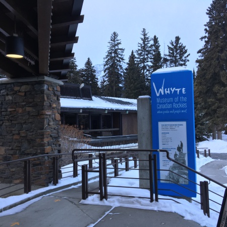 photograph of a snowy day in banff at the entrance to the whyte museum